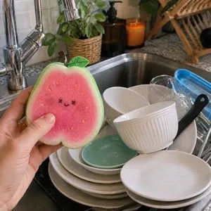 Customer holding pink fruit dish scrubber