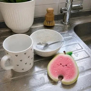 Customer fruit scrubber beside kitchen sink
