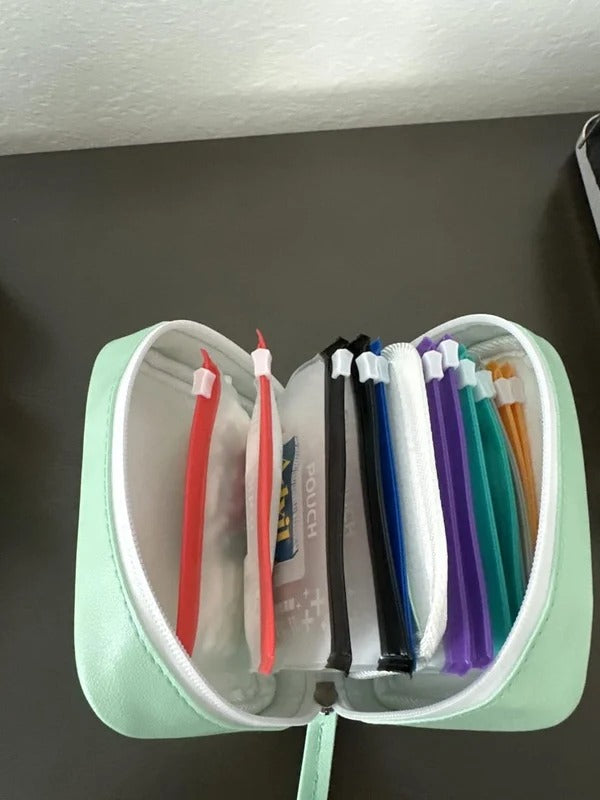 Mint organizer case opened with color-coded removable pouches