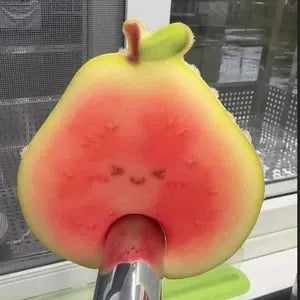 Fruit scrubber drying on kitchen faucet